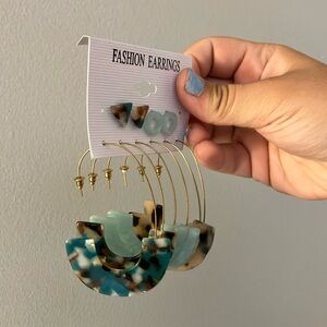 brown marble print hoops, blue marble studs and hoops & cheetah print hoops.